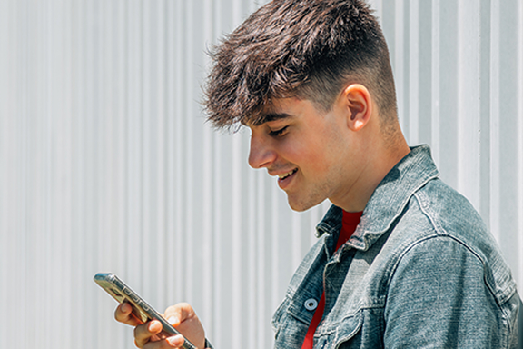 guy on mobile | CB | 576x384 guy on mobile | CB | 576x384