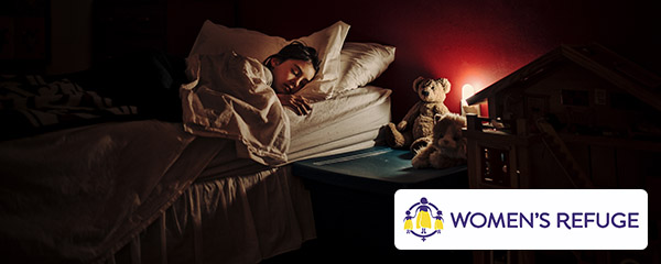 womans refuge woman sleeping with teddy bear 