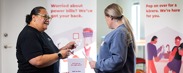 Contact employee helping a customer in the community