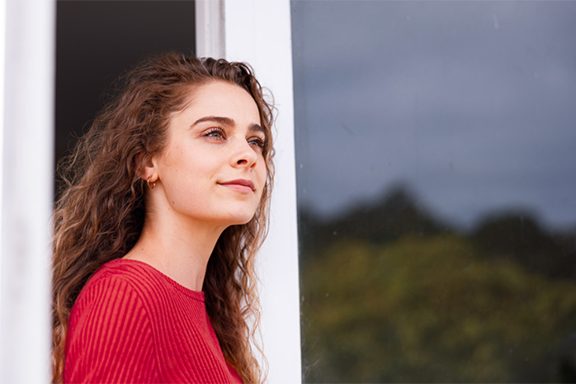woman looking outside | CB | 576x384
